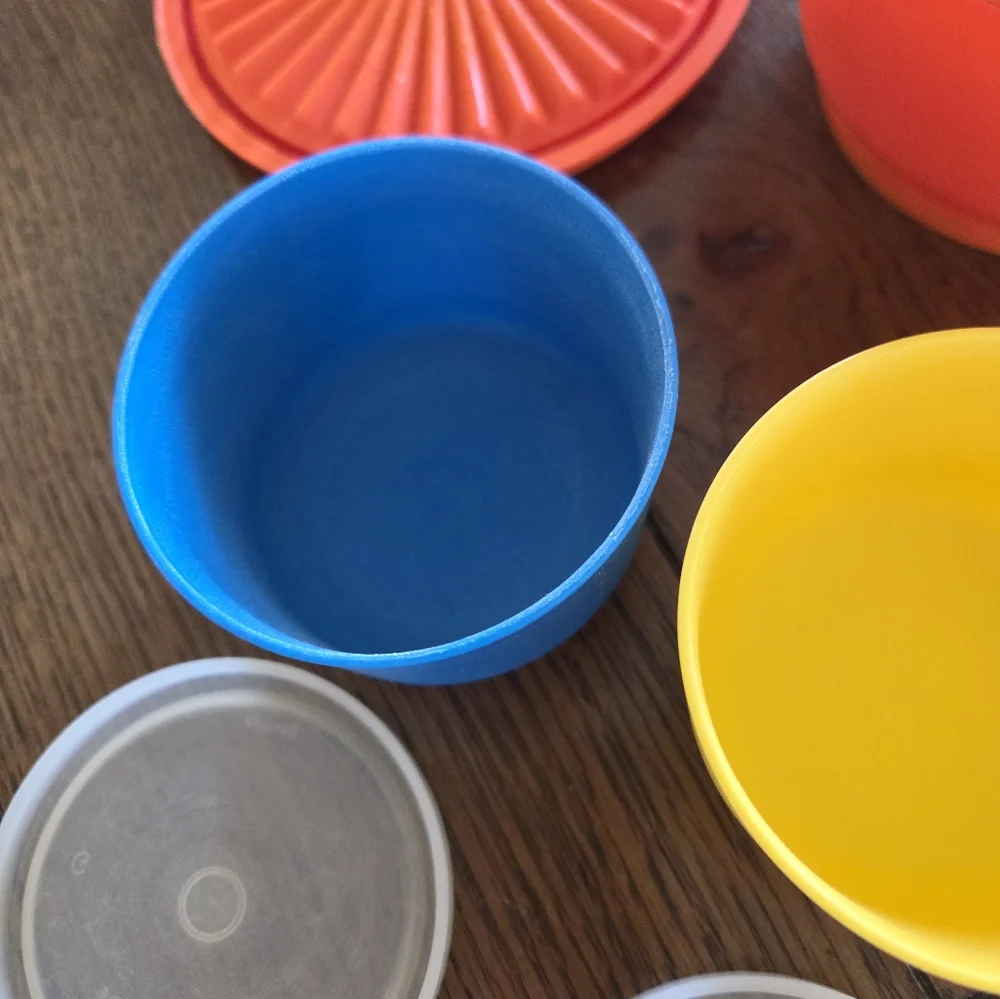 Colorful vintage Tupperware.  2 snack cups One 20 oz storage bowl.